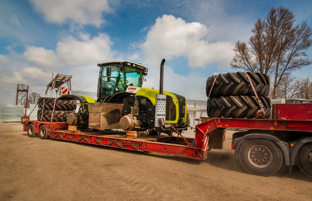 Heavy plant machinery transported on a low-loader trailer