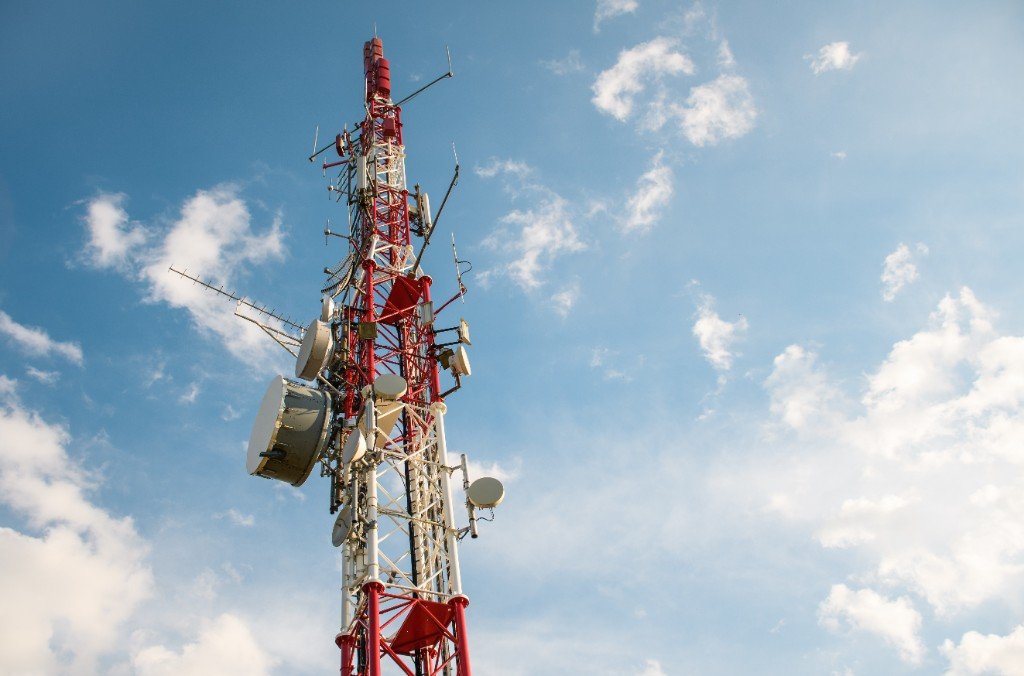 Telecommunications tower with antennas prepared for network site delivery